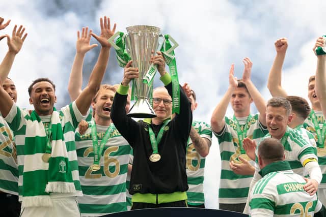 Celtic manager Martin O'Neill lifts the William Hill Premiership trophy following the 3-1 victory over Hearts on the final day of last season.