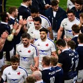 Scotland applaud France's players off the pitch in Paris after beating them 27-23 in the final match of the 2021 Six Nations. (Photo by MARTIN BUREAU/AFP via Getty Images)