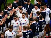Scotland applaud France's players off the pitch in Paris after beating them 27-23 in the final match of the 2021 Six Nations. (Photo by MARTIN BUREAU/AFP via Getty Images)