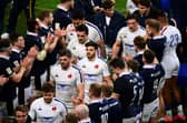 Scotland applaud France's players off the pitch in Paris after beating them 27-23 in the final match of the 2021 Six Nations. (Photo by MARTIN BUREAU/AFP via Getty Images)