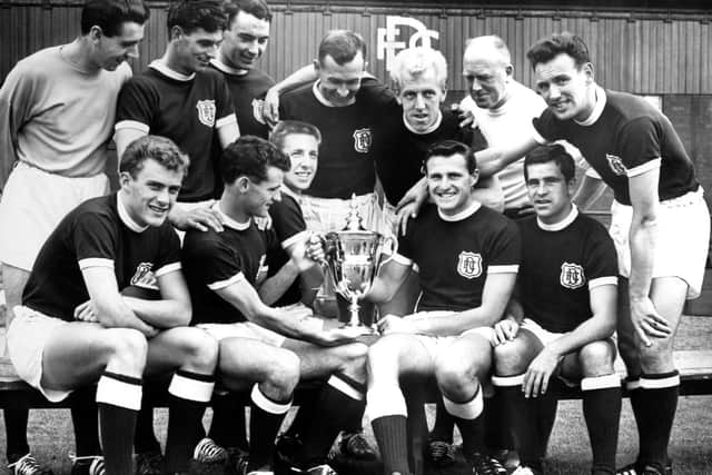 Bobby Wishart, back row fourth from left, looks down at the Scottish League Championship trophy won by Dundee in 1962.