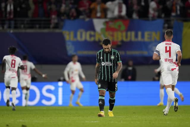 Celtic's Sead Haksabanovic, centre, reacts after Leipzig's Andre Silva scoring his side's third goal during the Champions League Group F match in Germany.