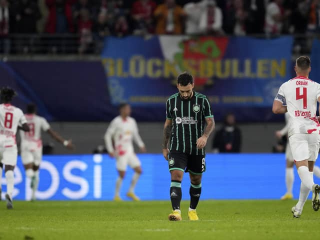 Celtic's Sead Haksabanovic, centre, reacts after Leipzig's Andre Silva scoring his side's third goal during the Champions League Group F match in Germany.