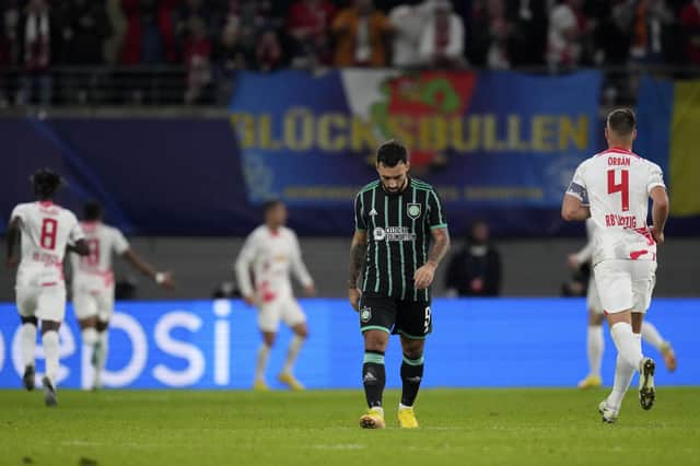 Celtic's Sead Haksabanovic, centre, reacts after Leipzig's Andre Silva scoring his side's third goal during the Champions League Group F match in Germany.
