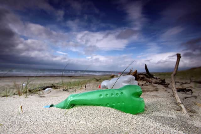 Plastic bottles and general rubbish washed up by the sea litter the beach at Prestwick (Picture: Christopher Furlong/Getty Images)