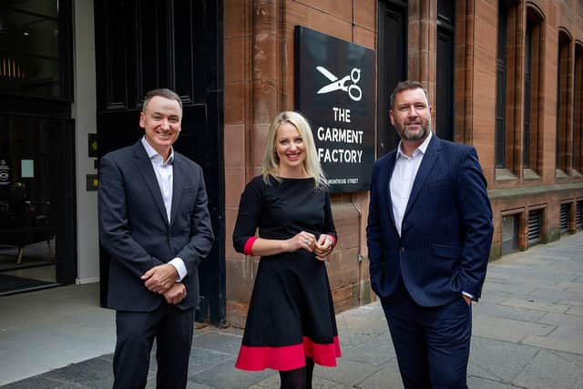 Michael McLaughlin, head of employment law for Shoosmiths in Scotland, Fiona Cameron, banking partner, and Barry McKeown, real estate partner and head of the Glasgow office, pictured outside the entrance to The Garment Factory where the firm has taken about 5,000 square feet of office space. Picture: Peter Sandground