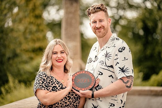 Christina and Ben with their trophy, which was presented at Glasgow's House For An Art Lover.