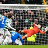 Celtic striker Kyogo Furuhashi curls the ball past Jack Butland in the Rangers goal.