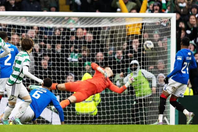 Celtic striker Kyogo Furuhashi curls the ball past Jack Butland in the Rangers goal.
