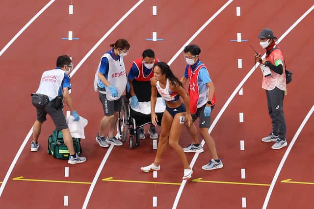 Katarina Johnson-Thompson receives medical attention after injuring her right calf during the heptathlon 200m. Picture: Rob Carr/Getty Images