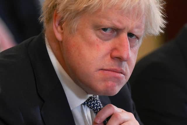 Boris Johnson removed a line from his foreword to the Ministerial Code that its 'precious principles... must be honoured at all times' (Picture: Daniel Leal/pool/AFP via Getty Images)