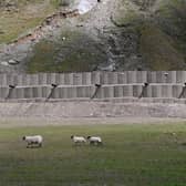 The 20ft-high bund built to protect the Old Military Road after it was engulfed by a landslide in 2020. (Photo by John Devlin/The Scotsman)