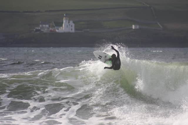 Unidentified surfer enjoying a brief moment of weightlessness at Thurso East PIC: Roger Cox / The Scotsman