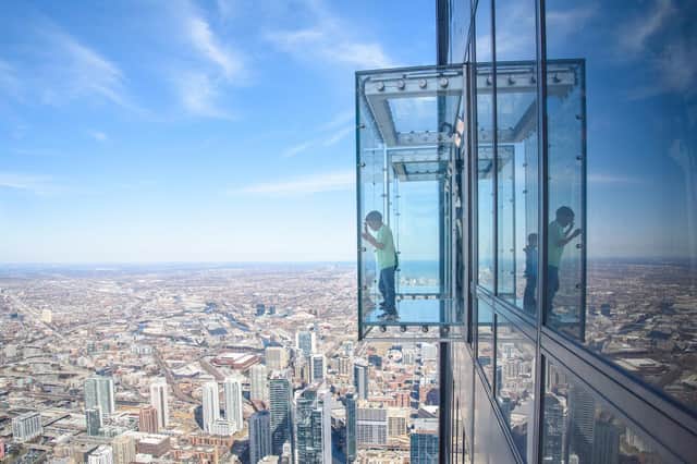 A child on The Ledge at Skydeck, Chicago, on the Willis Tower, the world's eighth talles building at 1,353 feet.