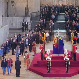 Members of the public file past the coffin of Queen Elizabeth II, draped in the Royal Standard with the Imperial State Crown and the sovereign's orb and sceptre, lying in state on the catafalque in Westminster Hall (Picture: Yui Mok/PA Wire)