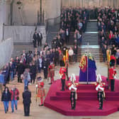 Members of the public file past the coffin of Queen Elizabeth II, draped in the Royal Standard with the Imperial State Crown and the sovereign's orb and sceptre, lying in state on the catafalque in Westminster Hall (Picture: Yui Mok/PA Wire)