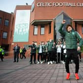 Kyogo Furuhashi leads the celebrations at Celtic Park after landing the title.