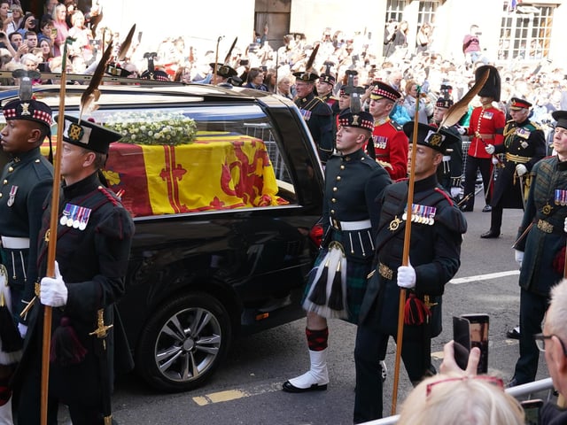 King Charles III and members of the royal family join the procession of Queen Elizabeth's coffin from the Palace of Holyroodhouse to St Giles' Cathedral, Edinburgh.Picture date: Monday September 12, 2022.