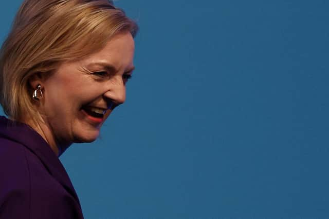 New Conservative Party leader and Britain's Prime Minister-elect Liz Truss leaves the stage after delivering a speech at an event to announce the winner of the Conservative Party leadership contest in central London. Picture: Adrian Dennis/AFP via Getty Images