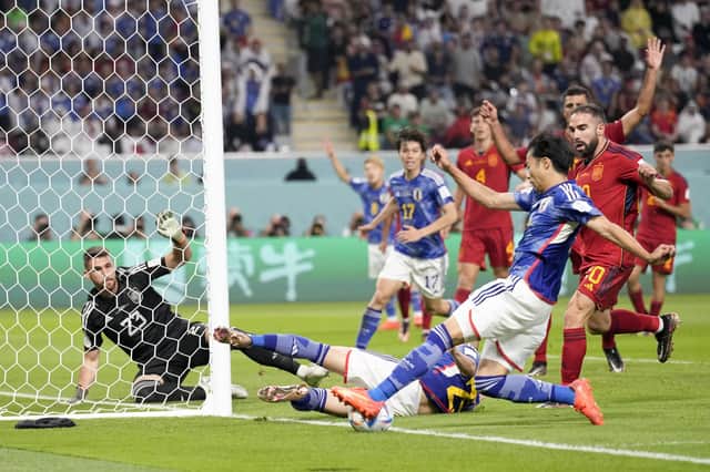 Japan's Kaoru Mitoma crosses for the second goal - but did the ball go out of play?