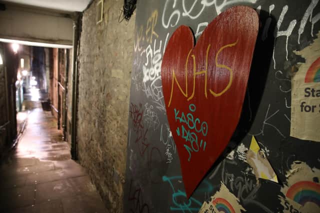 A heart with NHS written on it on the wall of a quiet alleyway in Edinburgh (Photo credit: Andrew Milligan/PA Wire).