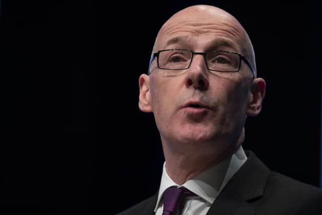 Education Secretary John Swinney said social distancing measures were likely to be in place for schools well into the next academic year