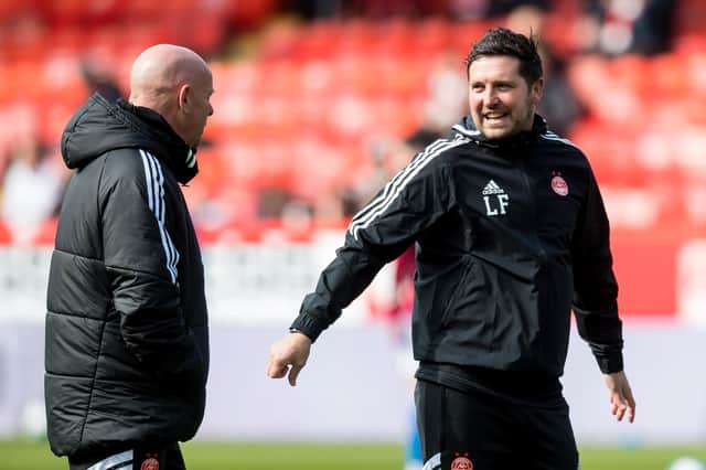 Aberdeen coach Liam Fox (right) and Steve Agnew (left) are a big part of Barry Robson's project at Pittodrie.