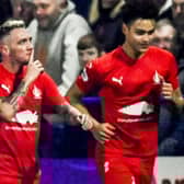 Falkirk's Callumn Morrison silences the home fans after scoring his side's second in the 5-1 win over Darvel in the Scottish Cup fifth round. (Photo by Rob Casey / SNS Group)