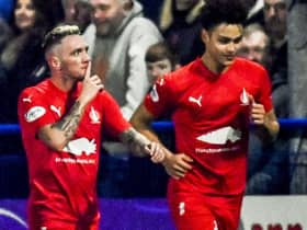 Falkirk's Callumn Morrison silences the home fans after scoring his side's second in the 5-1 win over Darvel in the Scottish Cup fifth round. (Photo by Rob Casey / SNS Group)