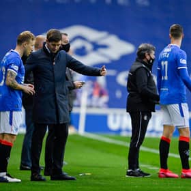 Rangers manager Steven Gerrard (centre) talks to Scott Arfield and Cedric Itten.