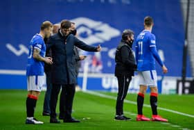 Rangers manager Steven Gerrard (centre) talks to Scott Arfield and Cedric Itten.
