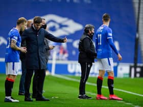 Rangers manager Steven Gerrard (centre) talks to Scott Arfield and Cedric Itten.