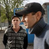 Ukranian men talk to journalists after they managed to flee from the Russian occupied territory of Kherson, earlier this month.