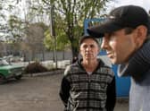 Ukranian men talk to journalists after they managed to flee from the Russian occupied territory of Kherson, earlier this month.