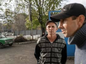 Ukranian men talk to journalists after they managed to flee from the Russian occupied territory of Kherson, earlier this month.