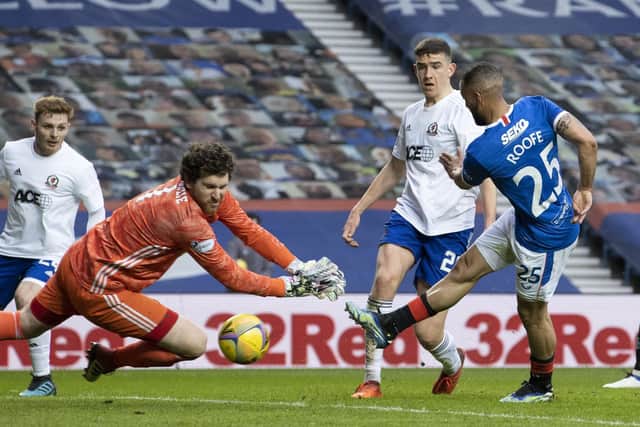 Kemar Roofe (R) makes it 2-0 during a Scottish Cup Third Round tie between Rangers and Cove Rangers at Ibrox Stadium, on April 04, 2021, in Glasgow, Scotland. (Photo by Alan Harvey / SNS Group)