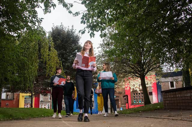 Rachel Simpson, one of the designers involved in producing this year’s Dundee Design Festival, leads the way on the new Hilltown Design Trail. Picture: Alan Richardson