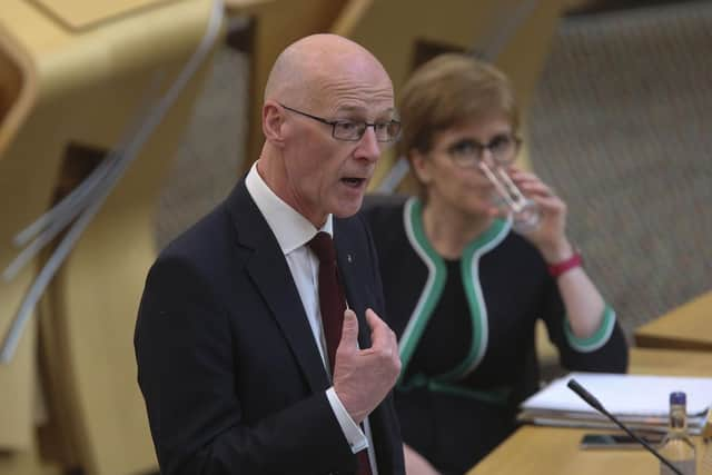 John Swinney told MSPs not to shout at him during testy exchanges in the Scottish Parliament over two delayed and over-budget ferries being built for Calmac (Picture: Fraser Bremner/Scottish Daily Mail/pool/PA)