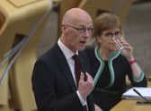 John Swinney told MSPs not to shout at him during testy exchanges in the Scottish Parliament over two delayed and over-budget ferries being built for Calmac (Picture: Fraser Bremner/Scottish Daily Mail/pool/PA)