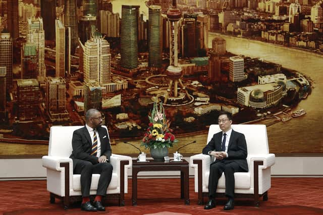 British Foreign Secretary James Cleverly, left, and Chinese Vice President Han Zheng attend a meeting at the Great Hall of the People in Beijing.