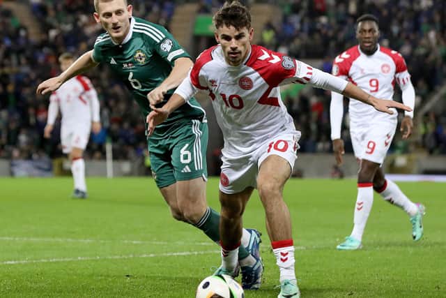 Matt O'Riley in action on his Denmark debut during the 2-0 defeat to Northern Ireland. (Photo by PAUL FAITH/AFP via Getty Images)
