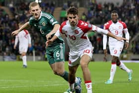 Matt O'Riley in action on his Denmark debut during the 2-0 defeat to Northern Ireland. (Photo by PAUL FAITH/AFP via Getty Images)