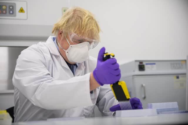 Boris Johnson visits the Valneva Covid-19 vaccine manufacturing plant in Livingston. Photo by Wattie Cheung-WPA Pool/Getty Images