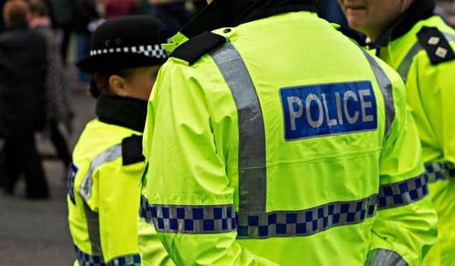 Police arrested and charged four men following an illegal march in Edinburgh on Saturday.