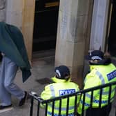 Andrew Miller (covered) being led from Selkirk Sheriff Court following an earlier hearing. Picture: PA