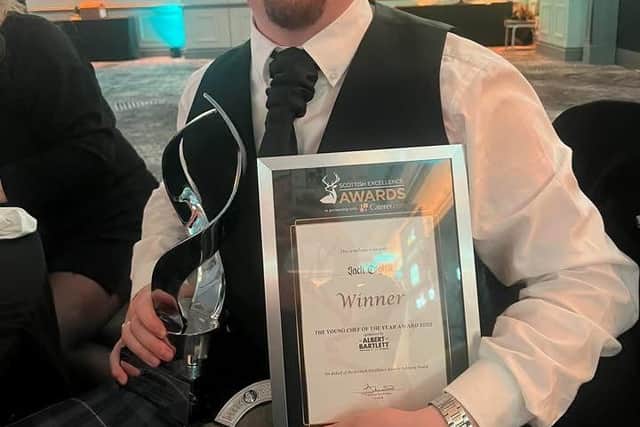 Jack Coghill with his trophy and certificate