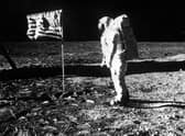 An image showing Astronaut Edwin Aldrin with the flag of the United States planted on the surface of the moon on the Apollo 11 mission.