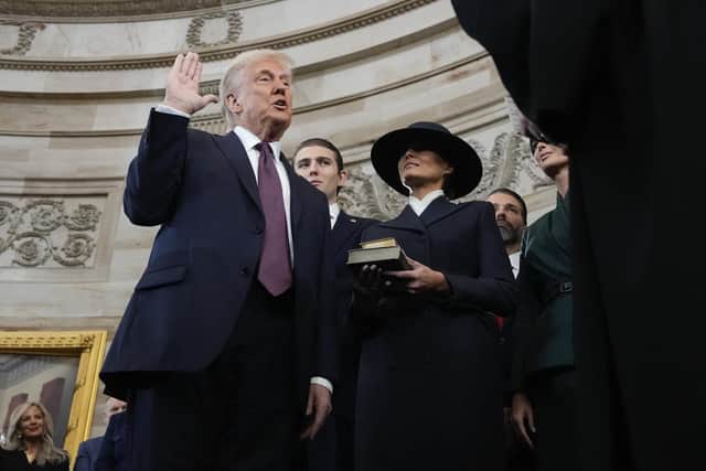 Donald Trump is sworn in as the 47th president of the United States by Chief Justice John Roberts as Melania Trump holds the Bible (Picture: Morry Gash/Pool/AFP via Getty Images)