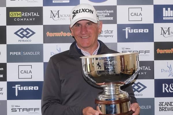 Euan McIntosh shows off his trophy after winning the Montrose Links Masters, the second event on this season's Tartan Pro Tour. Picture: Tartan Pro Tour.
