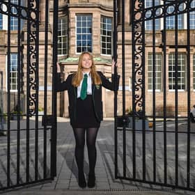 Hannah Douglas-Walker at the gates built by her great-grandfather.